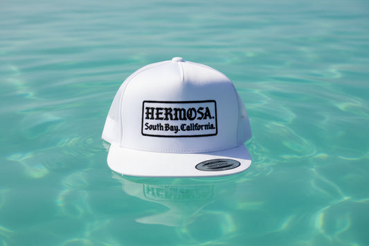 White cap with text on a textured surface